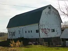 Barn on west side of road