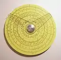 Pickett circular slide rule with two cursors. (4.25&nbsp;in/10.9&nbsp;cm width) Reverse has additional scale and one cursor.