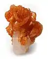 Tinzenite on calcite,  4.5 × 3.5 × 3&nbsp;cm. Wessels Mine, Kalahari manganese fields, Northern Cape Province, South Africa