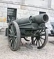 28&nbsp;cm barrel and recoil assembly on its transport cart in front of the Museum of the Polish Army in Warsaw